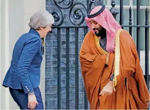  ?? AFP ?? Britain’s Prime Minister Theresa May greets Saudi Arabia’s Crown Prince Mohammed bin Salman outside 10 Downing Street in central London on Wednesday. —