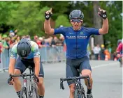  ??  ?? Aaron Gate celebrates after making a perfect start at the New Zealand Cycle Classic yesterday.