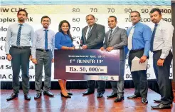  ??  ?? 1st Runner – UpAMW Capital Leasing &amp; Finance PLCreceivi­ng their award and prize from the Chief Guest Dr. Prasad Medawatte, the GCEO of Lanka Hospitals PLC and Mr. Pradeep Edward, the President of SLIM.