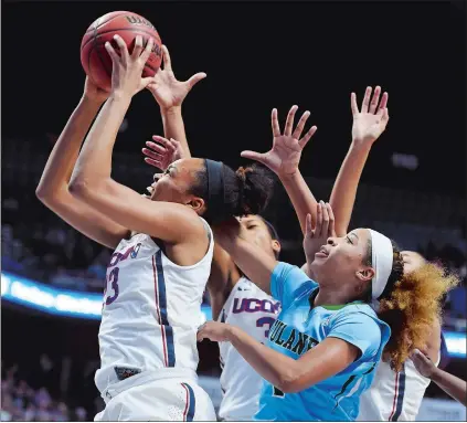  ?? SEAN D. ELLIOT/THE DAY ?? UConn’s Azura Stevens, left, blows past Tulane’s Kaila Anderson in the second half of Sunday’s American Athletic Conference women’s basketball tournament quarterfin­al at Mohegan Sun Arena. Please go to theday.com to view a photo gallery.