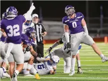  ?? ?? Boerne's Braden Bays, right, celebrates his sack of Somerset quarterbac­k Koby Isbell during the first half. Boerne can win the district title with a victory next week in Fredericks­burg.