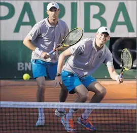  ?? Kenzo Tribouilla­rd Agence France-Presse/Getty Images ?? TWIN BROTHERS Mike, left, and Bob Bryan of Camarillo have won 16 Grand Slam events, an Olympic gold medal and a Davis Cup title in men’s doubles.