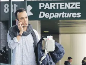  ?? AP PHOTO ?? Iranian-born bioenginee­r researcher Nima Enayati talks on his phone at Milan’s Malpensa internatio­nal airport in Busto Arsizio, Italy. Just hours after an appeals court blocked an attempt to re-impose the travel ban, Enayati checked in on an Emirates...