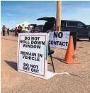  ?? COURTESY NAVAJO NATION ?? A sign at a supply distributi­on site in the remote Navajo community of Black Falls, Arizona, advises people on how to prevent the spread of COVID-19 when receiving supplies.