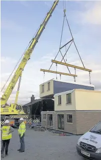  ??  ?? ●● One of the factory-built homes under constructi­on. Picture by David Greenwood