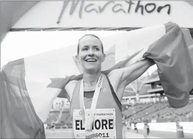  ?? BROOK JONES/Special to The Daily Courier ?? Kelowna’s Malindi Elmore smiles after winning the women’s half-marathon national championsh­ip in Winnipeg last June.