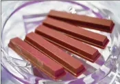  ?? AKIO KON / BLOOMBERG ?? Ruby chocolate KitKat bars, produced by Nestle, are among the new ideas that chocolate makers are rolling out to draw more discerning consumers.