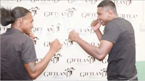  ??  ?? Keeve Allicock (right) and Imran ‘Magic’ Khan square off following their contract signing last week. The pair will match gloves on the ‘Locked and Loaded’ card at the Giftland Mall on April 9.