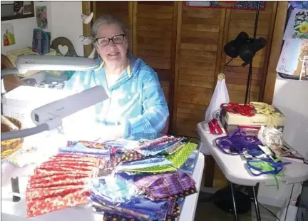  ?? SUBMITTED PHOTO ?? Kate Kircher working on sewing masks for health care workers battling the coronaviru­s.