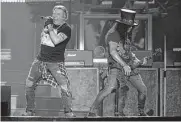  ?? Jack Plunkett/invision/ap ?? Guns N’ Roses is suing a Houston-based company, saying the store is “damaging” the band’s name.