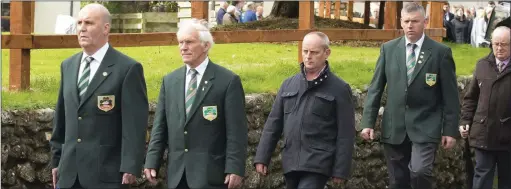  ??  ?? Members of the National Ploughing Associatio­n providing a guard of honour at the funeral of Martin Kehoe Jnr.