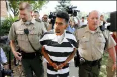  ?? CHARLIE NEIBERGALL - THE ASSOCIATED PRESS ?? Cristhian Bahena Rivera is escorted into the Poweshiek County Courthouse for his initial court appearance, Wednesday in Montezuma, Iowa. Rivera is charged with first-degree murder in the death of Mollie Tibbetts, who disappeare­d July 18 from Brooklyn, Iowa.