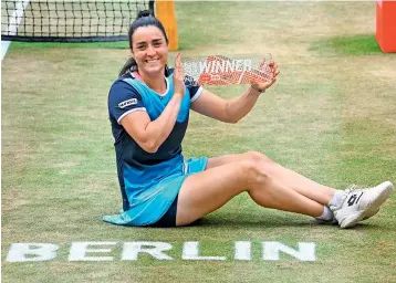 ?? — AFP ?? Ons Jabeur of Tunisia poses with the trophy after winning the Womens Bett1 Open final against Belinda Bencic of Switzerlan­d in Berlin on Sunday.