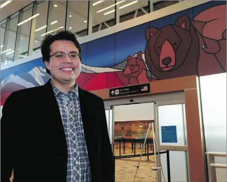  ?? Candace Elliot, THE Journal ?? Artist Jason Carter with his work titled Old Man Mountain with Great Mother Bear, which hangs in the U.S. customs area.