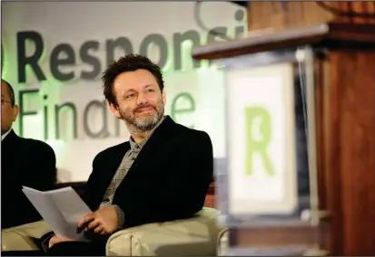  ??  ?? Actor Michael Sheen visited Scotcash in Dennistoun ahead of a speech at a finance conference at Glasgow City Chambers