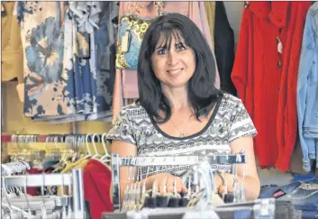  ?? ASHLEY THOMPSON ?? Terri Hulan opened Terri’s Casual Wear clothing store on Main Street in Kingston in June.