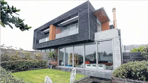  ?? Photos: FAIRFAX NZ ?? Strong lines: The solid house is so quiet inside that when a house was being built next door there was no constructi­on noise if the windows were closed.