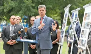  ?? STAFF PHOTO BY ERIN O. SMITH ?? Chattanoog­a Mayor Andy Berke points to the work of three artists chosen as semifinali­sts to create a permanent memorial honoring the five servicemen who died in the 2016 terror attack here. The artists were revealed at a Tuesday news conference at the...