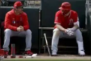  ?? CHRIS CARLSON - THE ASSOCIATED PRESS ?? Angels manager Brad Ausmus, left, talks with Mike Trout during the fourth inning of a spring training game against the Athletics in Mesa, Ariz., on Feb. 26.