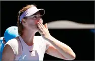  ??  ?? AP PHOTO BY VINCENT THIAN Russia's Maria Sharapova blows kisses to the crowd after she won over Germany's Tatjana Maria during their first round match at the Australian Open tennis championsh­ips in Melbourne, Australia, Tuesday.