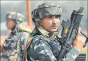  ?? AFP PHOTO ?? CRPF jawans stand guard after a gunfight with militants at Hajin village in Kashmir's Bandipora district on Wednesday.