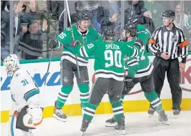  ??  ?? Stars right wing Brett Ritchie, No.25, celebrates his goal with teammates.