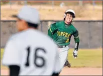  ??  ?? The Hilltopper­s’ Wesley Moss holds up at third after hitting a triple during the fifth inning of Wednesday’s game against Capital High in Santa Fe.