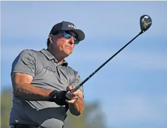  ?? AP PHOTO/DENIS POROY ?? Phil Mickelson hits his tee shot on the fifth hole of the South Course at Torrey Pines during the Farmers Insurance Open golf tournament in January.