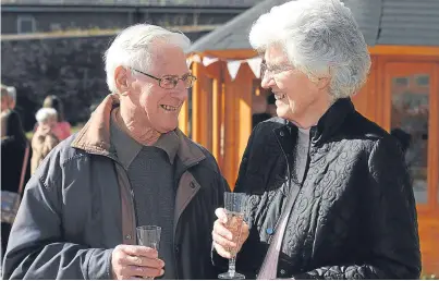  ?? Pictures: Kim Cessford. ?? Jim and Anne Wallace (who cares for Jim) at the dementia garden in Kirriemuir and, below, Anne chats to Amanda Kopel who officially opened the new facility.