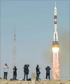  ?? Bill Ingalls NASA ?? THIS LAUNCH of a Soyuz spacecraft that was to carry one American and one Russian to the Internatio­nal Space Station failed, but the crew landed safely.