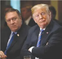  ??  ?? US SECRETARY of State Mike Pompeo and President Donald Trump listen during a cabinet meeting at the White House in Washington, July 18.