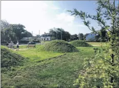  ??  ?? Three large play mounds in the center of the park provide climbing and rolling opportunit­ies for visiting youngsters.