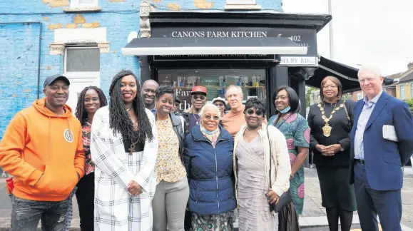  ?? CONTRIBUTE­D ?? Dawn Butler (second left) is joined by family and friends after a Blue Plaque was unveiled in her honour above the premises where her father had a bakery in Waltham Forest. At far right is Mayor Elizabeth Baptiste and John Cryer MP.