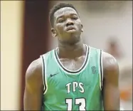  ?? Gregory Payan / Associated Press ?? The Patrick School’s Adama Sanogo signed his national letter of intent Friday to play men’s basketball at UConn.