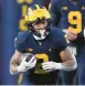  ?? PAUL SANCYA/AP ?? RB Blake Corum helped Michigan improve to 10-0 with a win over Nebraska on Saturday.