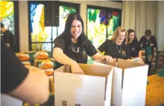  ?? (Hadas Parush/Flash 90) ?? VOLUNTEERS OF the Leket Israel charity organizati­on and president’s residence workers pack boxes with food for families in need ahead of Passover, at the President’s Residence in Jerusalem in 2016.