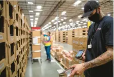  ?? RADIAL/CONTRIBUTE­D PHOTO ?? A Radial employee scans an item at one of the company’s U.S. fulfillmen­t centers. Radial, which has more than 20 fulfillmen­t centers, including one in Forks Township, is hiring seasonal workers ahead of the holidays.