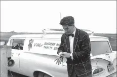  ?? Galt Archives photo
1975240005­5 ?? An unidentifi­ed reporter with CJOC Radio in Lethbridge tends to a minor injury he received while covering the blowing of the entrance of the No 3 mine on Feb. 6, 1961.