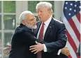  ??  ?? Mr Trump greets Narendra Modi yesterday