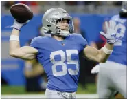  ?? DUANE BURLESON — THE ASSOCIATED PRESS ?? Detroit Lions’ receiver Tom Kennedy throws a 75-yard pass to receiver Kalif Raymond for a touchdown on a trick play during Sunday’s win over Green Bay Packers.