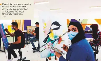  ?? AFP ?? Palestinia­n students, wearing masks, attend their final classes before graduation at Palestine Technical University yesterday.