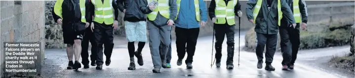  ??  ?? Former Newcastle Falcons players on the Doddie Weir charity walk as it passes through Elsdon in Northumber­land