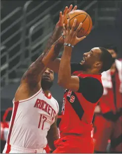 ?? AP PHOTO CHRIS O’MEARA ?? Toronto Raptors guard Norman Powell (24) shoots against Houston Rockets forward P.J. Tucker (17) during the first half of an NBA basketball game Friday, in Tampa, Fla.