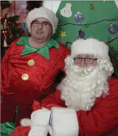  ??  ?? Santa Claus with his elf Frank Thornton at the Lakers Christmas Party at the Brady Centre