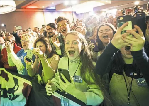  ?? Steph Chambers/Post-Gazette ?? Supporters cheer during the election party for Conor Lamb, winner of the U.S. House seat for the 17th Congressio­nal District, on Tuesday at the DoubleTree by Hilton hotel in Cranberry.