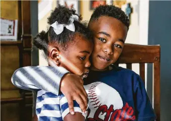  ?? Marvin Pfeiffer / Staff photograph­er ?? Josiah Shaw, 7, and his sister, Naomi, 5, have been “loved back to life,” said their adoptive mother, LaKenya. The siblings were found in near-death states in the backyard of a Bexar County home.