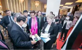  ?? Photo courtesy of the embassy ?? GOING GREEN: Ambassador Grete Løchen (with pink scarf) introducin­g to Deputy Prime Minister Lê Văn Thành the Norwegian profile on renewable energy particular­ly offshore wind at the Internatio­nal Conference in Hà Nội on May 13.