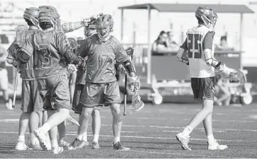  ?? JEN RYNDA/BALTIMORE SUN MEDIA GROUP ?? Glenelg players celebrate a goal by Tyler Reiff (17). Reiff had three first-half goals, while Kyle Dry and Eric Gruber added two apiece in the first three quarters to keep the Gladiators unbeaten in Howard County play at 7-0.