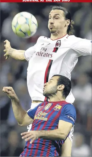  ?? Picture: AP. ?? AC Milan’s Zlatan Ibrahimovi­c jumps for the ball with Barcelona midfielder Javier Mascherano during last night’s Champions League match between AC Milan and Barcelona at the San Siro. See report on page 48.