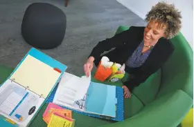  ?? Bebeto Matthews / Associated Press ?? Mary Beth Nerone, a former middle-school teacher from Rochester, N.Y., shows materials from her online store, Brain Waves Instructio­n, in New York.